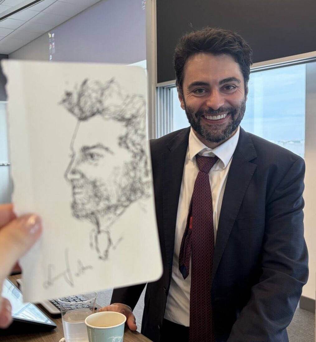 The professor, holding the portrait